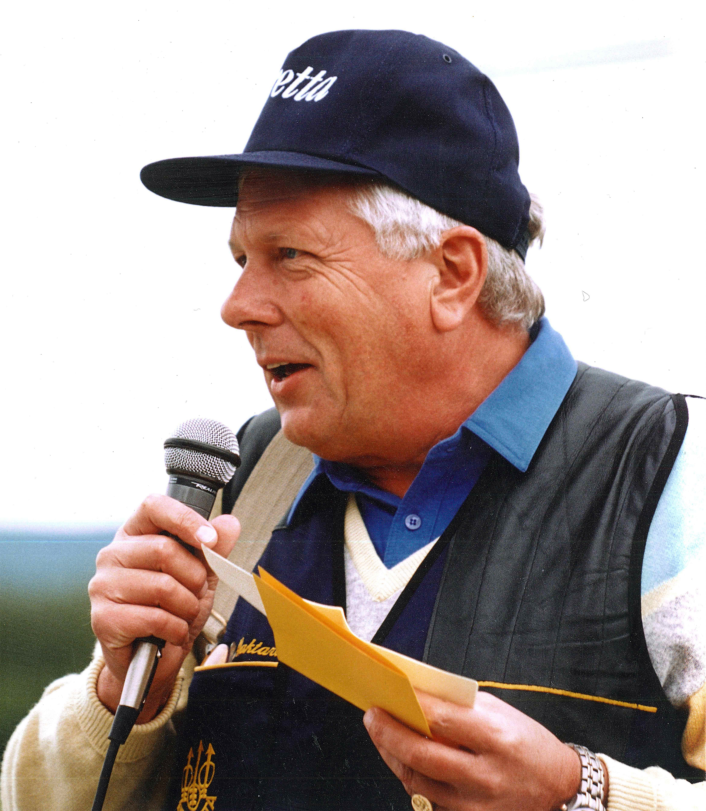 Bjorn Waktare speaking into a microphone